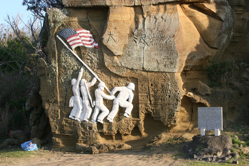 Replica of Iwo Jima flag raising etched on rock