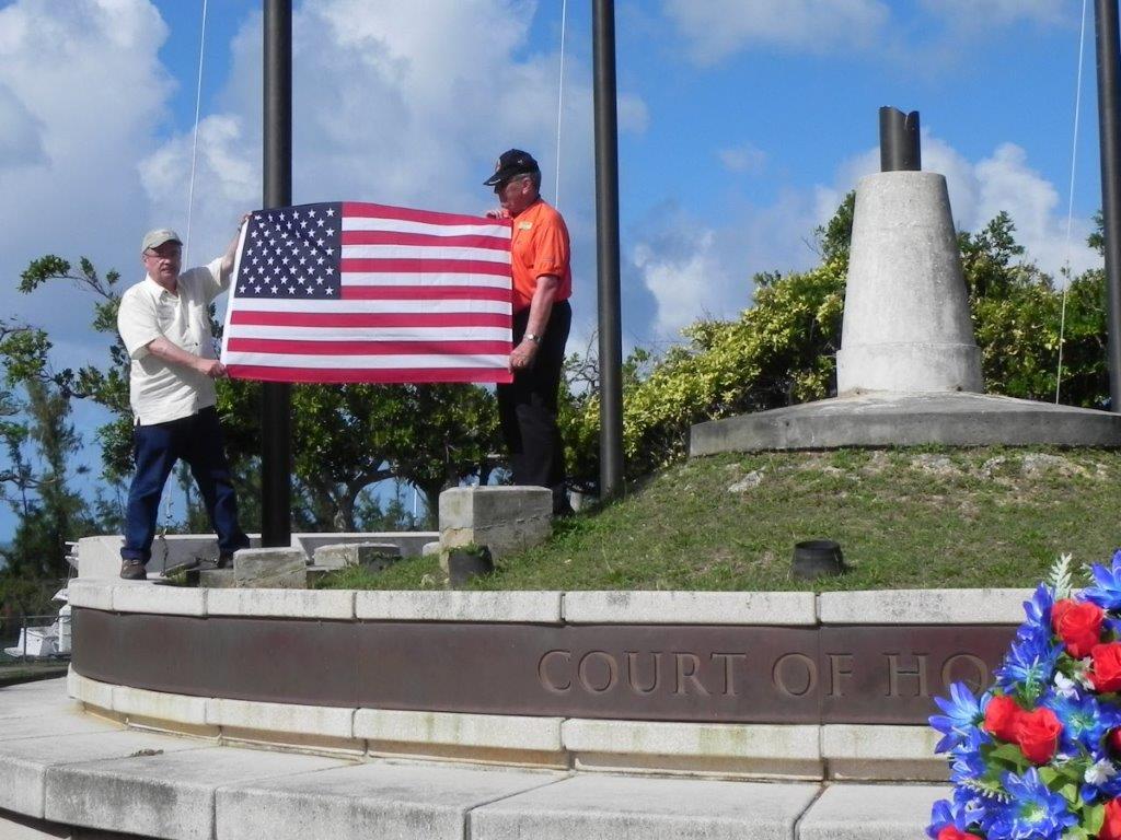 Raising American flag at American Memorial Park