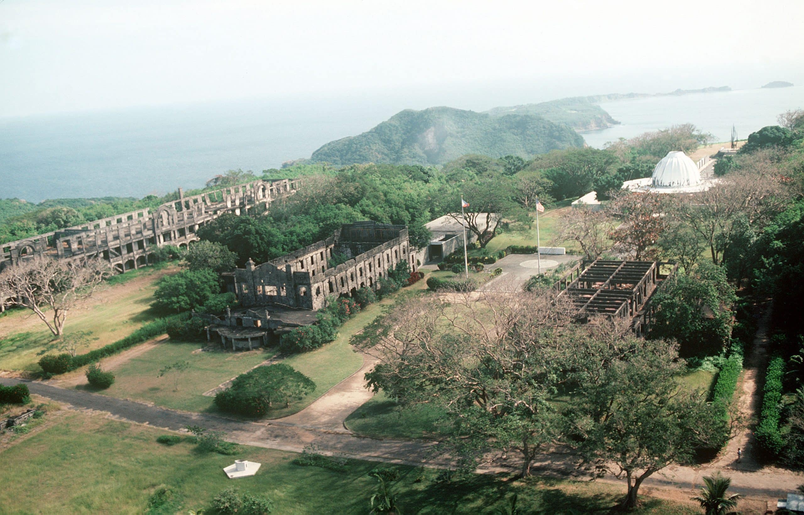 Aerial view of ruins and a memorial to American defenders of Corregidor